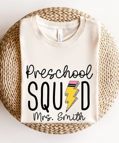 Show off your preschool pride with our Preschool Teacher Shirt. This retro-inspired tee is perfect for back to school, teacher appreciation, or any day you want to celebrate your role as a preschool educator. Join the Preschool Squad and make a stylish statement in the classroom! Product Description: ⇝ Bella and Canvas Brand Shirts ⇝ Unisex Adult Sizing ⇝ Rolled Sleeves in pictures are for styling purposes only ⇝ Props used in photos for are NOT included with purchase ⇝ Please consult the listin Preschool Staff Shirts, Preschool Teacher Tshirts, Preschool Director Outfits, Back To School T-shirt With Heat Transfer Vinyl, Customizable Crew Neck School T-shirt, Customizable Cotton T-shirt For School Spirit, Cotton T-shirt With Team Name For School Events, School Spirit T-shirt With Team Name For School Events, School Spirit Tops For Daycare And Back To School