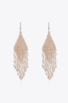 Beaded Dangle Earrings Elevate your style with our exquisite Beaded Dangle Earrings. These stunning accessories are the perfect blend of elegance and charm, meticulously crafted to complement any outfit. Key Features: Material: Made with high-quality beads for a sophisticated look. Measurements: 4.5 inches in length and 1.1 inches in width, ensuring an eye-catching dangle effect. Imported: Curated from exquisite international sources for premium quality. Care Instructions: Use a soft cloth: Afte Silver Beaded Tassel Drop Earrings, Elegant Tassel Earrings With Round Dangling Beads, Elegant Beaded Metal Crystal Earrings, Beaded Dangle Chandelier Earrings For Party, Silver Beaded Tassel Earrings, Beaded Metal Chandelier Earrings For Party, Elegant Metal Beaded Earrings With Round Beads, Gold Beaded Drop Earrings For Party, Elegant Silver Beaded Tassel Earrings