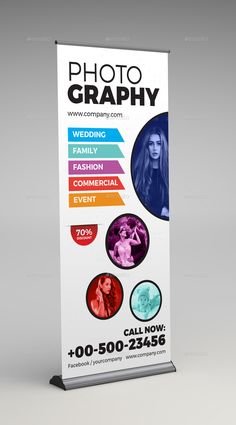 a white roll up banner with photos on it