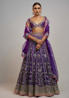 Editor's Note Adorn yourself in our exquisite deep purple brocade lehenga skirt, adorned with stunning gold and silver thread and sequins, paired elegantly with a meticulously handcrafted blouse this lehenga set is perfected with an embroidered organza dupatta, creating a truly enchanting ensemble. Dark Purple Lehenga, Modern Lehenga Designs, Lehenga Purple, Indian Fits, Wedding September, Brocade Lehenga, Desi Vibes