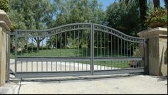 an iron gate is opened to allow people to enter the house or property in order to see what's on the other side