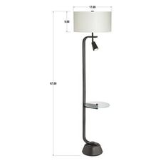 the floor lamp has a white shade on it and is next to a black stand