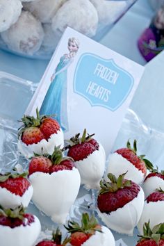 strawberries and marshmallows are on display at a frozen treats party for children