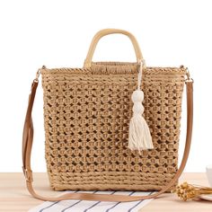 Expertly crafted with high-quality woven straw, the Straw Bag Beach Hollow Woven Bag is a must-have for any beach-goer. Its sturdy design and spacious interior make it perfect for carrying all your essentials, while the chic and stylish look is sure to elevate any outfit. Stay organized and fashionable with this versatile bag. This women's beach bag is crafted with unique hollow woven straw design, perfect for a day at the beach. Its spacious interior and sturdy handles make it ideal for carrying all your essentials. Constructed with durable materials, this bag is both stylish and functional. Woven Beach Bags, Cotton Handbag, Straw Beach Bag, Straw Bags, Raffia Bag, Top Handle Handbags, Straw Tote, Casual Tote, Women's Handbags