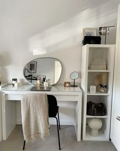 a white desk with a mirror on top of it