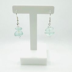 🌊 Sea Glass and Czech Crystal Earrings - Coastal Jewelry 🌊 Indulge in the serene allure of our meticulously handcrafted sea glass and Czech crystal earrings, where the beauty of the ocean meets the sparkle of crystal clarity. Each pair is meticulously handcrafted to capture the essence of coastal charm, showcasing unique sea glass pieces delicately paired with shimmering Czech crystals. Key Features: Handcrafted Excellence: Meticulously crafted for quality and uniqueness. Coastal Charm: Perfec Minimalist Beach Jewelry With Ear Wire, Elegant Recycled Glass Earrings With Ear Wire, Czech Glass Drop Earrings For Beach, Elegant Jewelry With Sea Glass And Ear Wire, Elegant Sea Glass Jewelry With Ear Wire, Teardrop Sea Glass Earrings With Ear Wire, Handmade Sea Glass Dangle Earrings, Beach Earrings With Sea Glass And Ear Wire, Beach Earrings In Silver With Recycled Glass