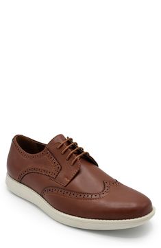 A faux leather pair of sneakers are elevated with wingtip stitching for casual-yet-cool style. Round toe Lace-up vamp Synthetic upper/rubber sole
 Imported Casual Low-top Lace-up Shoes With Brogue Detailing, Casual Wingtip Oxford Lace-up Shoes, Casual Oxford Wingtip Lace-up Shoes, Casual Oxford-style Lace-up Wingtip Shoes, Casual Sneakers With Brogue Detailing And Round Toe, Casual Low-top Oxfords With Brogue Detailing, Casual Wingtip Lace-up Shoes With Textured Sole, Casual Wingtip Lace-up Shoes With Contrast Sole, Casual Brown Oxfords With Perforated Toe Box