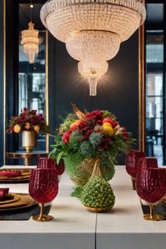 Elegant dining table with ornate chandeliers, lush floral centerpieces, and red glass goblets. Eclectic Kitchen