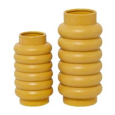 two yellow vases sitting next to each other