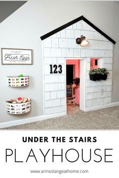 a doll house with the words under the stairs playhouse