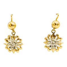 This is part of Chairish’s Fine Jewelry assortment  Highly stylized dangling flower earrings each containing a .07 carat old mine cut diamond for an approximate total diamond weight of .14 carats.  The earrings are made of 14k yellow gold. Flower Shaped Diamond Earrings With Diamond Cut, Formal Flower-shaped Diamond Earrings With Single Cut Diamonds, Formal Flower Shaped Earrings With Single Cut Diamonds, Formal Single Cut Diamond Flower Shaped Earrings, Formal Flower-shaped Single Cut Diamond Earrings, Diamond Flower-shaped Earrings With Accents, Flower-shaped Diamond Earrings With Single Cut Diamonds, Diamond White Earrings With Diamond Accents In Flower Shape, Diamond Flower Shaped Earrings With Accents