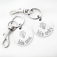 two keychains with the words his and her on them, one has a pair of scissors