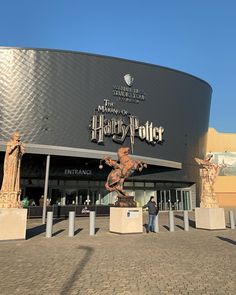 people are standing in front of the entrance to harry potter