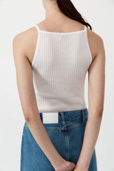 A sleek, contemporary take on the classic tank. Boasting a square neck, thin straps, metal trim and hip length, the Square Tank is crafted from a 100% TENCEL™ Lyocell rib knit for a super soft silhouette-conforming fit. Bridal Tops, Garment Details, St Agni, Short Loungewear, Cotton Citizen, Layering Tanks, Fit Details, Denim Maxi Skirt, Metal Trim