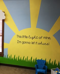 a child's room with a painted wall and chair in front of the window that says this little light of mine, i'm'm gona let it shine