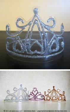 three different crowns sitting on top of a table