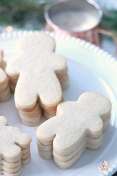 some cut out cookies on a white plate