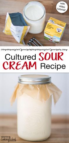 a jar filled with sour cream next to a spoon and butter on a wooden table