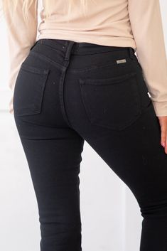 KanCan Jeans The Paulina High Rise Jeans are designed to offer a classic chic look with their flared, bootcut fit and carefully crafted details. Featuring whiskering and a gently faded wash, these jeans exude timeless style. They sit above the natural waistline, tapering down the thigh and flaring out at the calf, creating a flattering silhouette. Crafted with stretch denim, these jeans move with your body while maintaining their shape even after multiple wears, ensuring both comfort and durability. With a classic five-pocket design, single-button front, and zip-fly closure, these jeans combine functionality with fashion, making them a versatile addition to your wardrobe for various occasions. Color: Black Cut: Boot Cut, 10" Inseam* Rise: High-Rise, 33" Front Rise* Material: 94.7% Cotton, Kancan Jeans, Los Angeles Usa, Classic Chic, Boot Cut Jeans, High Rise Jeans, Cut Jeans, Pocket Design, Timeless Style, Bootcut Jeans