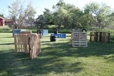 there are many wooden crates in the yard