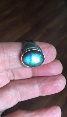 This is a very unique ring I purchased in a vintage jewelry auction. Set in the antique silver plated setting is one beautiful chunk of oval BLUE LABRADORITE gemstone. The stone is not to large as you can see in the photo's. The ring is stamped 925 (very difficult to see, but it's there). The ring shows very little wear... mint condition! The ring is sterling silver over copper base. Ring Size: 9.75 Jewelry Auction, Ladies Ring, Labradorite Ring, Blue Labradorite, Unique Ring, Blue Rings, Ring Vintage, Ring Size 7, Plate Sets