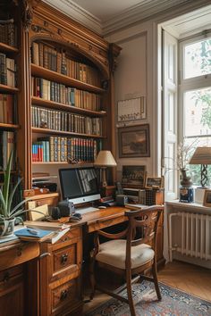 a home office with bookshelves, desk and chair in front of a window