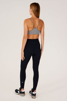 Our famous, form fitting high waist legging redesigned as a stirrup tight. Our ultra luxe Airweight fabric has a supremely soft hand and second skin comfort. BEST FOR: hot yoga, barre, Pilates. Model is 5'10" and wears a size small. Sleek Yoga Activewear With Built-in Bra, High Stretch Leggings With Built-in Bra For Yoga, High Waist Yoga Activewear With Built-in Bra, Compressive High-waist Activewear With Built-in Bra, Stretch Sports Bra With Light Support For Barre, Compressive Activewear With Built-in Bra For Barre, Sleek Activewear With Built-in Bra And Stretch, High Stretch Sleek Sports Tights, Sleek High Stretch Sports Tights