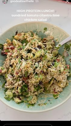 a bowl filled with salad sitting on top of a table