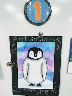 a refrigerator with magnets and pictures on the fridge's front door that says first grade 1, snowy penguin