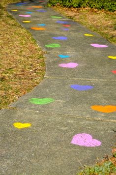 the sidewalk is painted with colored dots