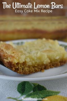 the ultimate lemon bars easy cake mix recipe on a white plate with a green leafy tablecloth