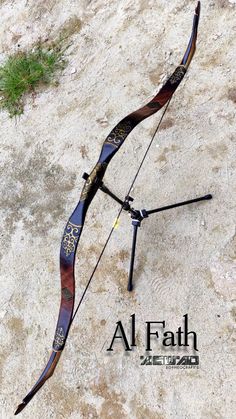 a bow and arrow laying on the ground