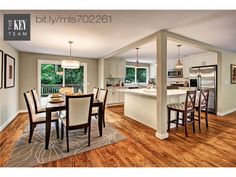 a kitchen and dining room with hardwood floors