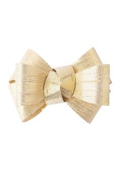 a gold bow tie on a white background