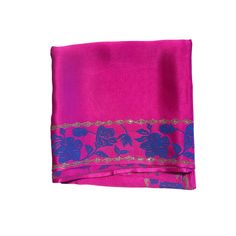 Maharani pink organic peace silk scarf with hand block printed floral motifs on the borders. The motifs have lotus and hibiscus flowers with little stylized leaves.  The base fabric is from a Gots certified peace silk manufacturer, who ensures that the silkworms hatch out of their cocoons as butterflies and complete their natural life cycle.  You can style it to complement various outfits. Wear it as a Bandeau top, or wrap it around your neck as a choker to look fresh and modern throughout the s Traditional Pink Dupatta With Block Print, Traditional Pink Block Print Dupatta, Pink Floral Print Silk Scarves, Pink Silk Scarf With Floral Print, Festive Pink Block Print Dupatta, Pink Unstitched Embroidered Saree, Pink Unstitched Silk Dupatta, Pink Dupatta With Block Print In Traditional Drape, Pink Unstitched Saree With Embroidered Border