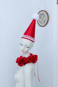 Please zoom in for detail and read entire description.  Lux red satin Pierrot hat and neck ruffle. The hat has a very valentine feel with the LACE, it's the first one I've designed with lace and I am IN LOVE. The neck ruffle is all satin and has a lot of personality with a gorgeous shine and a soft feel. It ties at back with french grosgrain ribbon. Or, you can wear it with the bow tied in front, see last photo.  The ruffle from end to end excluding the ribbon ties is about 14" and fits a necks 12.5"-14" well. Please ask any fit questions you may have! The hat is from the same satin as the neck ruffle. It stays on with a flat elastic chin strap which is adjustable. It's generally a one-size-fits-all adult heads, as it balances over the crown of your head. It's lightweight but holds its sha Red Christmas Costume Hat, Red Christmas Costume Hat And Headpiece, Red Carnival Costume Hat, Red Costume Hats For Carnival Party, Pierrot Costume, Costume Clown, Clown Costume, Red Satin, Ribbon Tie