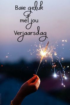 someone holding a sparkler in their hand with the words bae geluk met you vergarsdag