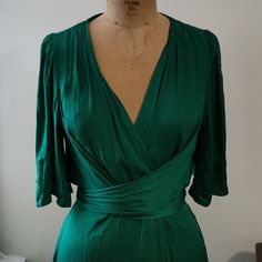 This Flowy Dress Is Gorgeous For Work Or Any Occasion. There Is A Button Inside To Secure It, A Button Outside, And Then A Tie That's Long Enough To Tie It In The Front Or The Back. I Couldn't Capture The Exact Green That This Is, But It's An Emerald Green Colour. Comes From A Smoke And Pet Free Home There Are Also Extra Buttons Sewn Into The Tag On The Inner Bottom Of The Dress. Emerald Green Colour, Emerald Green Dress, Karen Millen Dress, Black Embroidered Dress, Emerald Green Dresses, Fuchsia Dress, One Shoulder Midi Dress, Athletic Dress, Denim Overall Dress