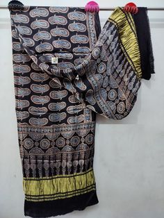 FREE Petticoat with every Saree and Legging with every Dupatta Order Pure Hand Block Print Modal Silk Ajrakh Handblock Dupattas, With Tissue Pallu , Organic Colors, Natural Dyed,Dupatta for Women Shipping through DHL, FedEx, UPS, Indian Speed post, USPS Measurements: Length: 100 Inch Width: 44 Inch Fabric : Modal Silk with Tissue Pallu Work: Ajrakh Hand block Print Feel: Soft Color: 100% Organic/Vegetable NOTE: As it is purely handmade, design may slightly vary while deliver.  FEATURES  - Handcr Bohemian Black Chanderi Dupatta, Bohemian Black Saree With Kalamkari Print, Black Cotton Bohemian Saree, Black Bohemian Cotton Saree, Bohemian Black Cotton Saree, Traditional Black Batik Print Dupatta, Bohemian Indigo Cotton Dupatta, Black Cotton Dupatta With Bandhani Print, Black Cotton Saree With Kalamkari Print