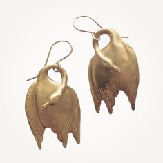 Description Graceful and unexpected. Vintage-inspired gold swan earrings. Earrings hang about 1.5". 14K gold dipped ear wires with natural brass swans. We will include a free pair of rubber safety backs with your purchase. WHAT IS GOLD DIPPED? Gold dipped is the best alternative to solid gold, and that's why we use gold dipped metals in our jewelry designs. Our gold dipped jewelry components have 150-200 layers of pure solid gold over a base metal. Unlike gold- plated metals, our gold withstands Swan Earrings, Classic Pearl Earrings, Gold Swan, Real Pearl Earrings, Bullet Earrings, Vintage Inspired Earrings, Crystal Earrings Wedding, Gold Earrings Wedding, Starburst Earrings