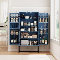 a blue shelf filled with lots of kitchen items