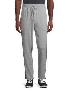 Comfortable lounge pants enhanced with contrasting logo tape on the sides..Drawstring waistband.Front slip pockets.Cotton/polyester.Machine wash.Imported.SIZE & FIT.Rise, about 13'.Inseam, about 29'.Leg opening, about 14'.Comfortable lounge pants enhanced with contrasting logo tape on the sides.Drawstring waistbandFront slip pocketsCotton/polyesterMachine washImportedSIZE & FITRise, about 13'Inseam, about 29'Leg opening, about 14'.Men's Apparel.Men's.Loungewear Calvin Klein Loungewear, Men's Loungewear, Comfortable Lounge, Clothing Pants, Calvin Klein Men, Men's Apparel, Drawstring Waistband, Lounge Pants, Pants Trousers