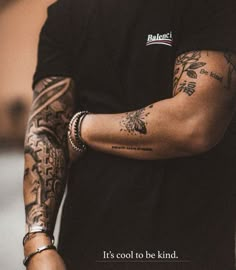 a man with tattoos on his arm and arms