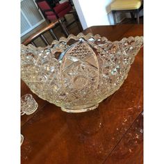 a glass bowl sitting on top of a wooden table