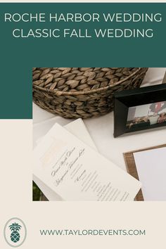 a table topped with papers and pictures next to a basket