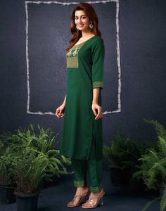 Dark Green Cotton Sequence Straight Kurta Set With Dupatta  Dark Green Cotton Sequence Straight Kurta Set With Dupatta is a glamorous and sparkling ensemble. The intricate sequence work, often arranged in floral motifs or geometric patterns, adds a dazzling shimmer to the kurta. The straight cut provides a modern and streamlined silhouette, while the accompanying dupatta can be styled in various ways to complete the look.  Features Of Dark Green Cotton Sequence Straight Kurta Set With Dupatta  T Fitted Pant Set With Zari Work For Diwali, Fitted Pant Set For Diwali Festive, Fitted Pant Set For Diwali Festival, Fitted Pant Set For Diwali, Festive Straight Kurta Pant Set, Festive Fitted Straight Kurta Pant Set, Fitted Pant Set With Pallu For Diwali, Festive Green Pant Set With Resham Embroidery, Festive Fitted Pant Set With Straight Kurta