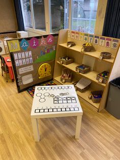 a child's playroom with toys and books