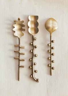 Three different shaped canape spoons in brass. Copper Measuring Spoons, Cool Objects To Buy, Air Dry Sculpture, Unique Spoons, Kitchen Utensils Design, Utensil Rest, Unique Utensils, Medieval Home Decor, Spoon Feeding