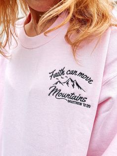 Get ready to fall in LOVE with your Faith Can Move Mountains embroidered cute Christian sweatshirt. It's the cutest and most comfortable way to share your God's love with others. Also makes a great gift!  * PRODUCT DETAILS * ✺ Soft preshrunk 50% cotton, 50% polyester blend ✺ Medium weight fabric (super soft feel) ✺ Wash and dry normally (on cool for best results) ✺ Designed and printed in the USA ✺ Due to different monitor screens, colors may vary ✺ * SIZING * ✺ FOR AN OVERSIZED FIT, SELECT TWO Cute Long Sleeve Embroidered T-shirt, Pink Tops With Embroidered Graphics For Winter, Winter Long Sleeve T-shirt With Embroidered Text, Cute Letter Embroidery Sweatshirt For Winter, Cute Crew Neck Sweatshirt With Embroidered Logo, Cute Crew Neck Top With Embroidered Text, Cute Crew Neck Sweatshirt With Embroidered Text, Cute Long Sleeve T-shirt With Embroidered Text, Pink Winter Tops With Letter Embroidery