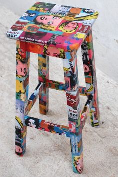 a multicolored stool made out of magazines